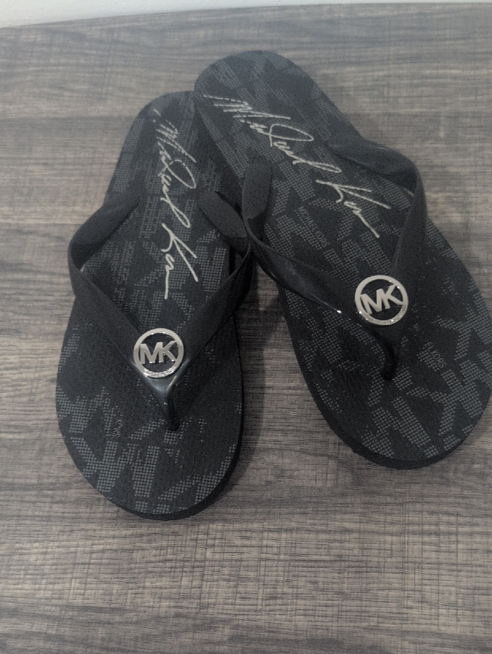 Michael Kors Black Flip Flops With Silver MK Logo